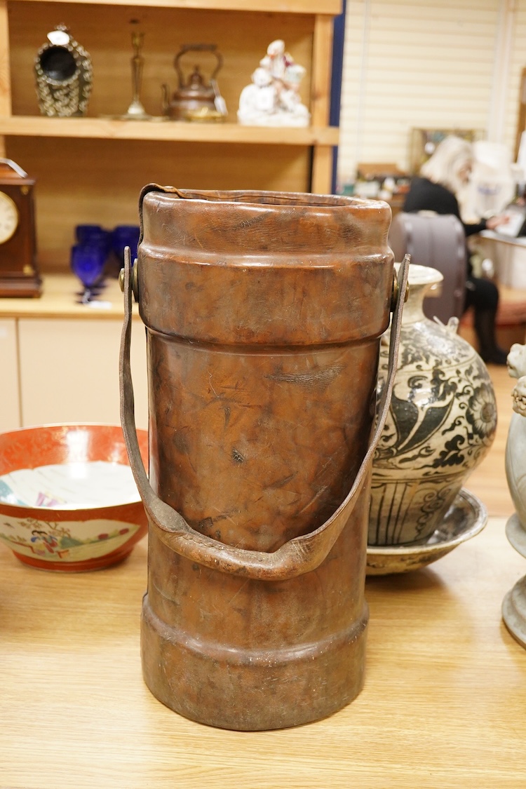 A late 19th century leather shot carrier printed with The Royal Coat of Arms, 46cm high